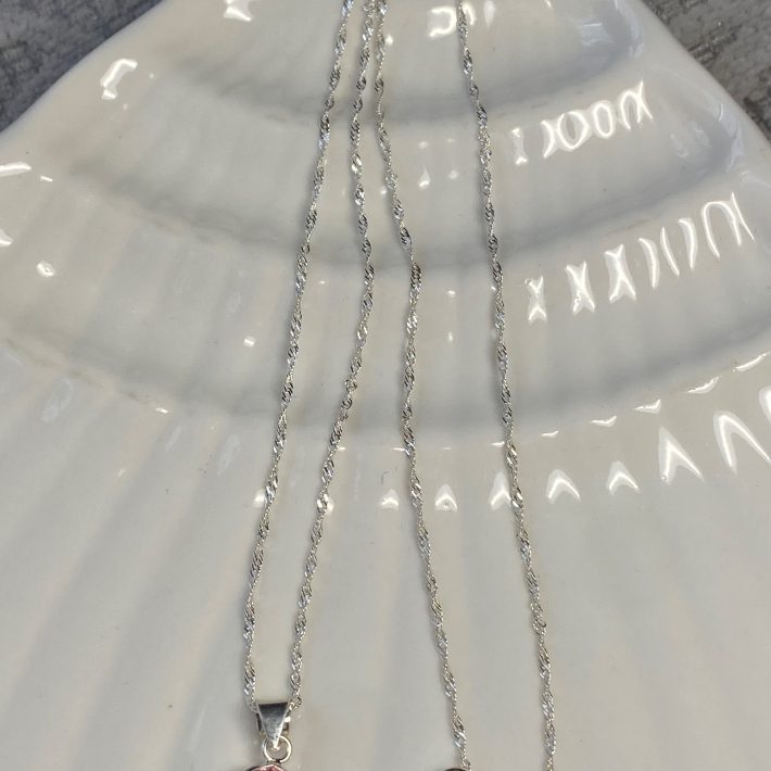 PUNTO DE LUZ REDONDO CON MICROCIRCONES ROSADO